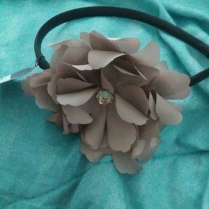 Grey flower headband.